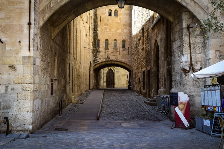 The alleyway through the old city of Narbonne next to the Palace of the Archbishop