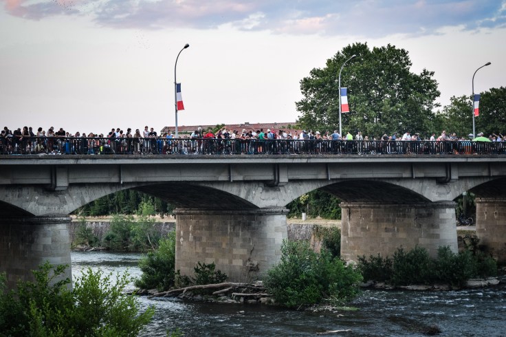 A large crowd of people gathered on a bridge in Carcassonne for the fireworks