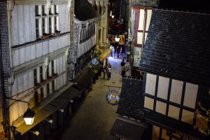 The narrow shop lined streets of Mont Saint Michel at night
